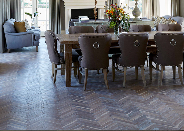 Herringbone wood floor in kitchen with green decor